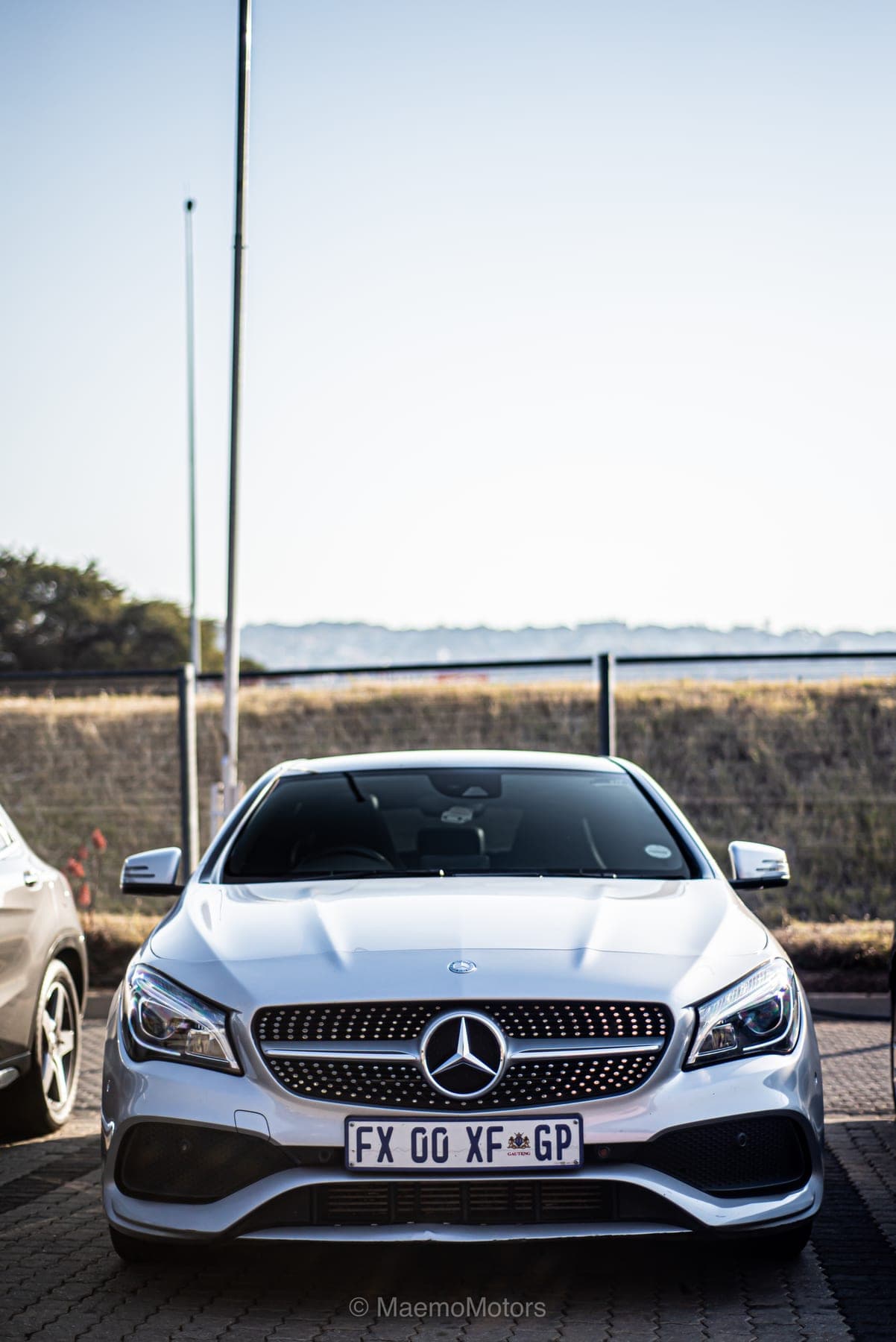 White Mercedes CLA head-on in the evening light