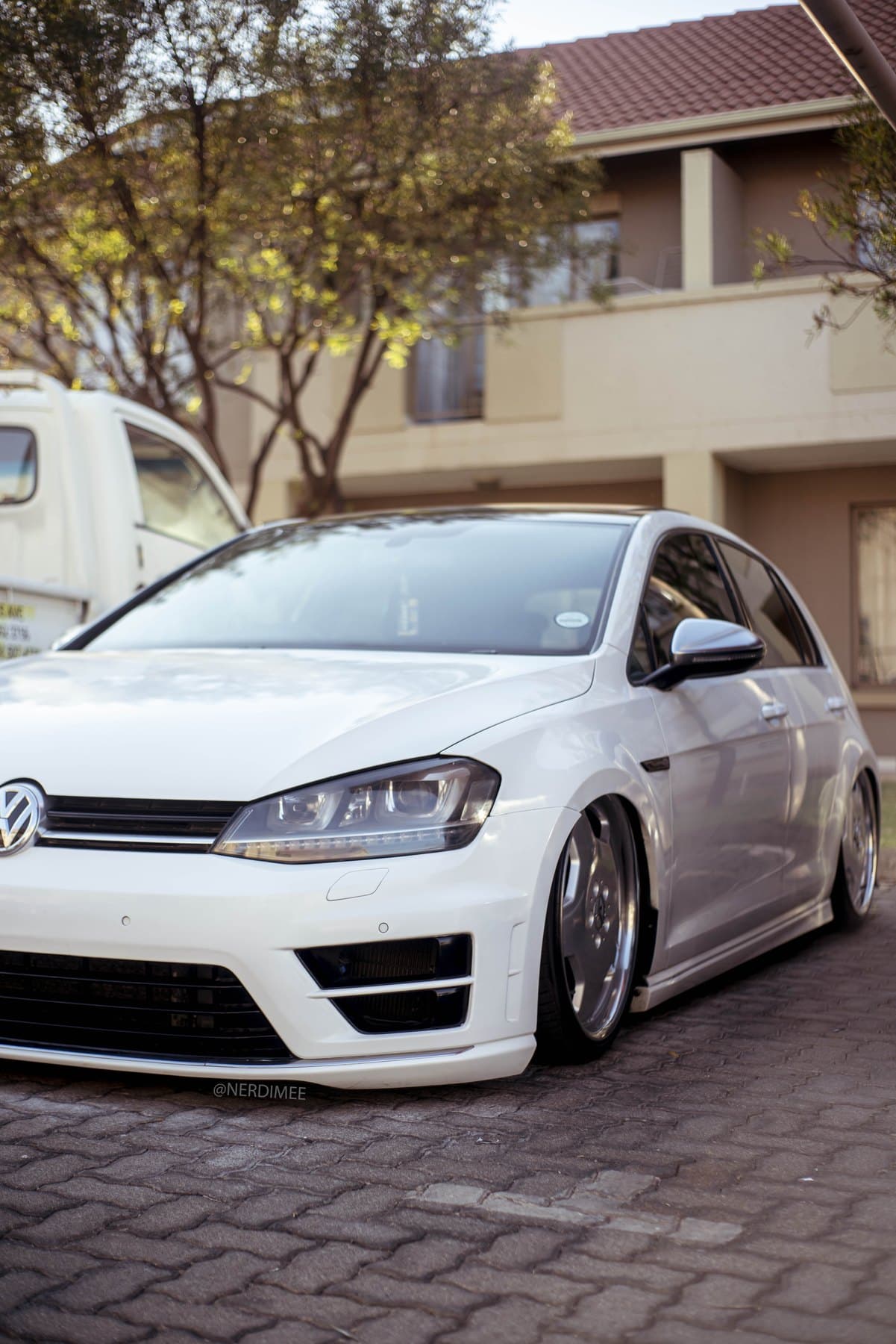 White Golf R sitting low on polished dishes