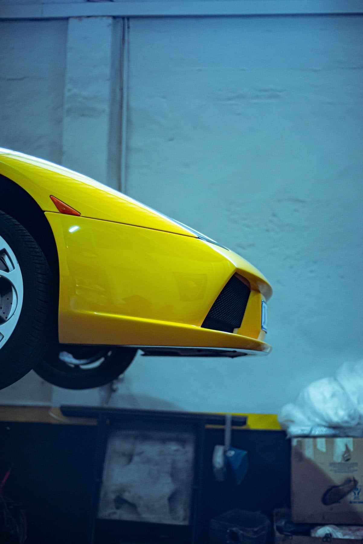 Yellow Lamborghini nose in a workshop