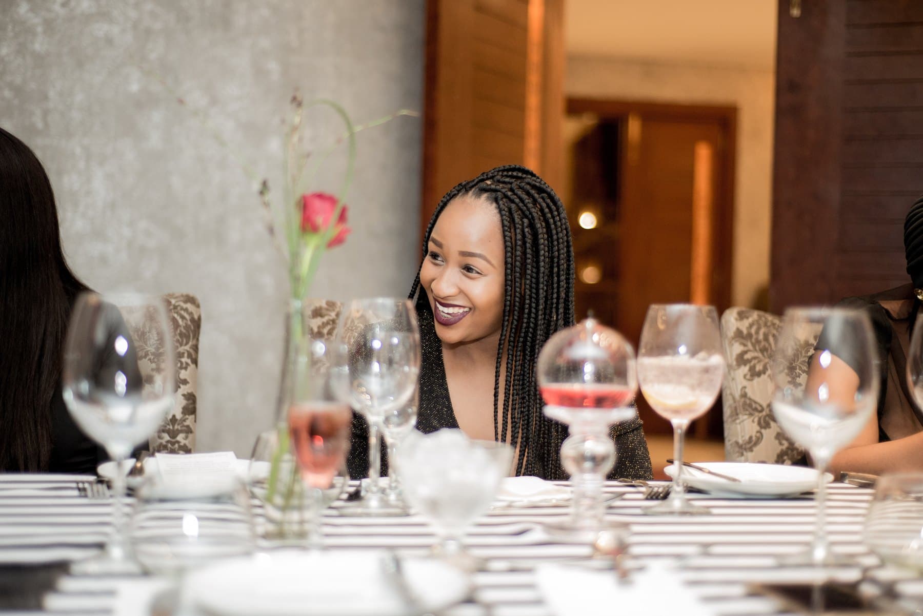 Laughing across a set dinner table