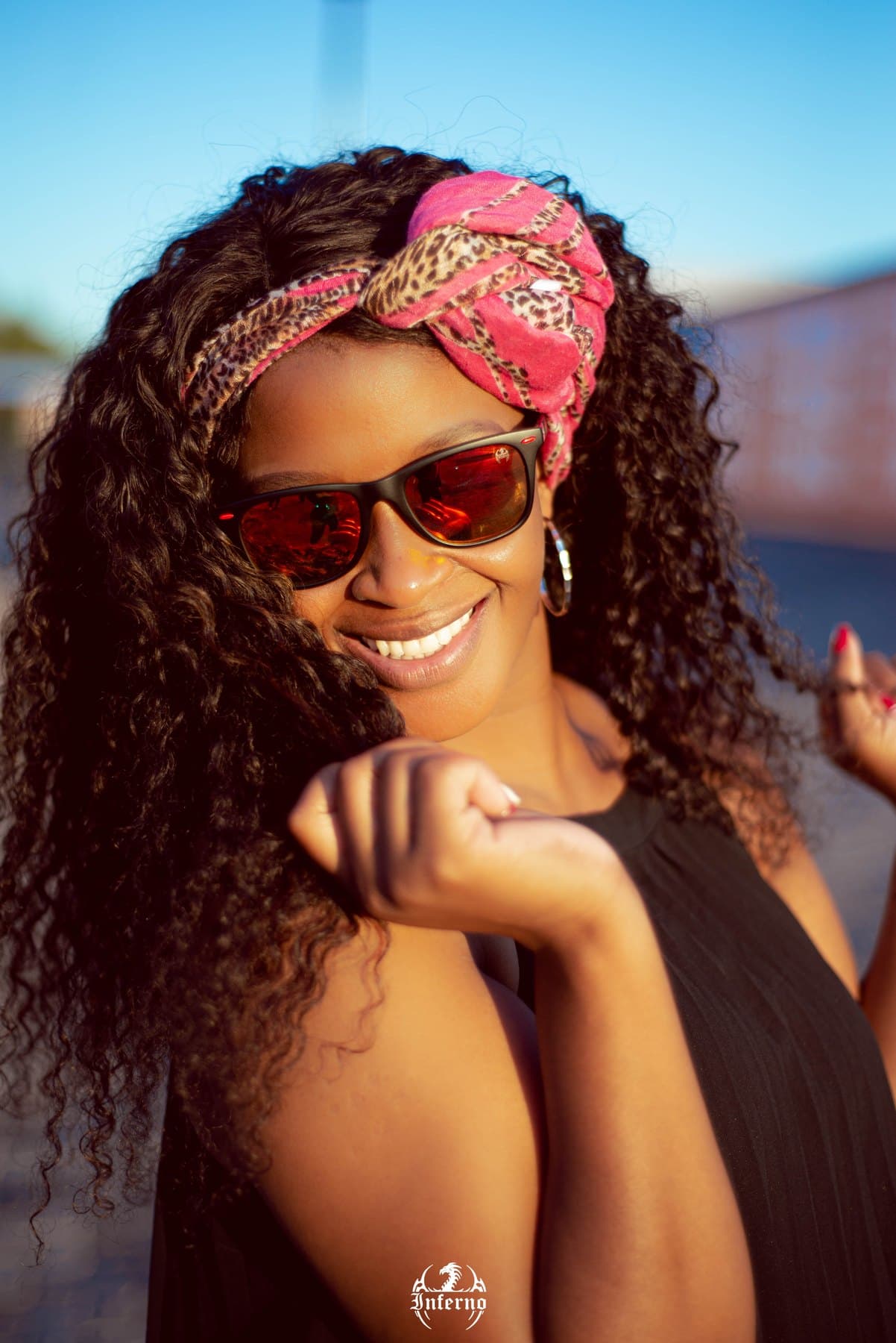 Red mirrored Inferno lenses, curls and a leopard scarf