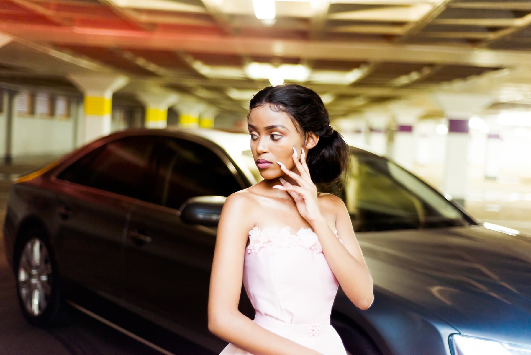 Pink strapless dress in a parking garage