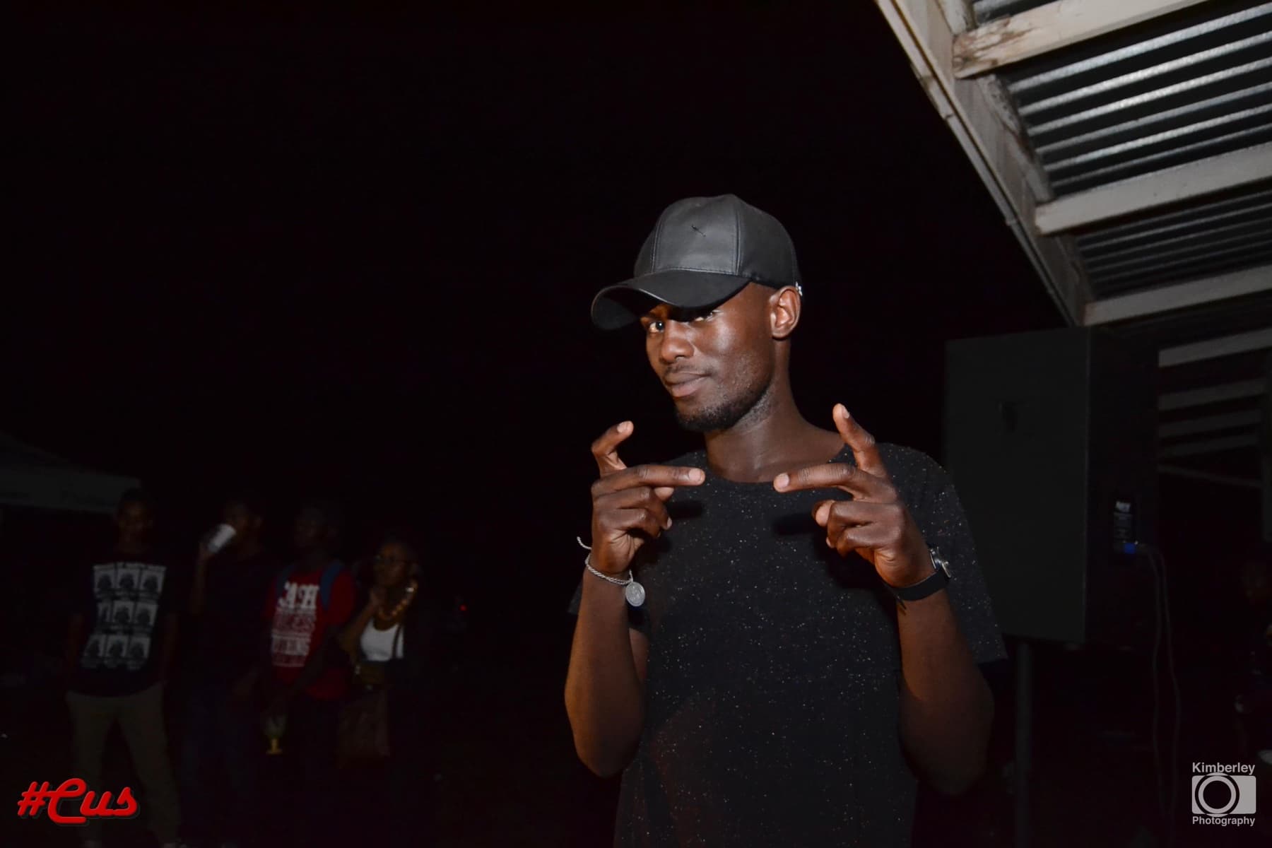 Leather cap and a double finger point at the #Cus night