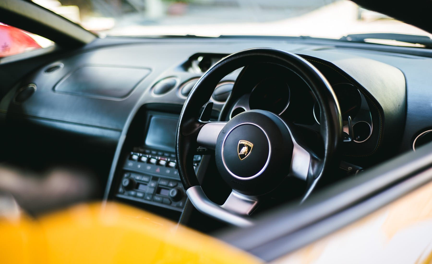 Lamborghini cabin over a yellow door