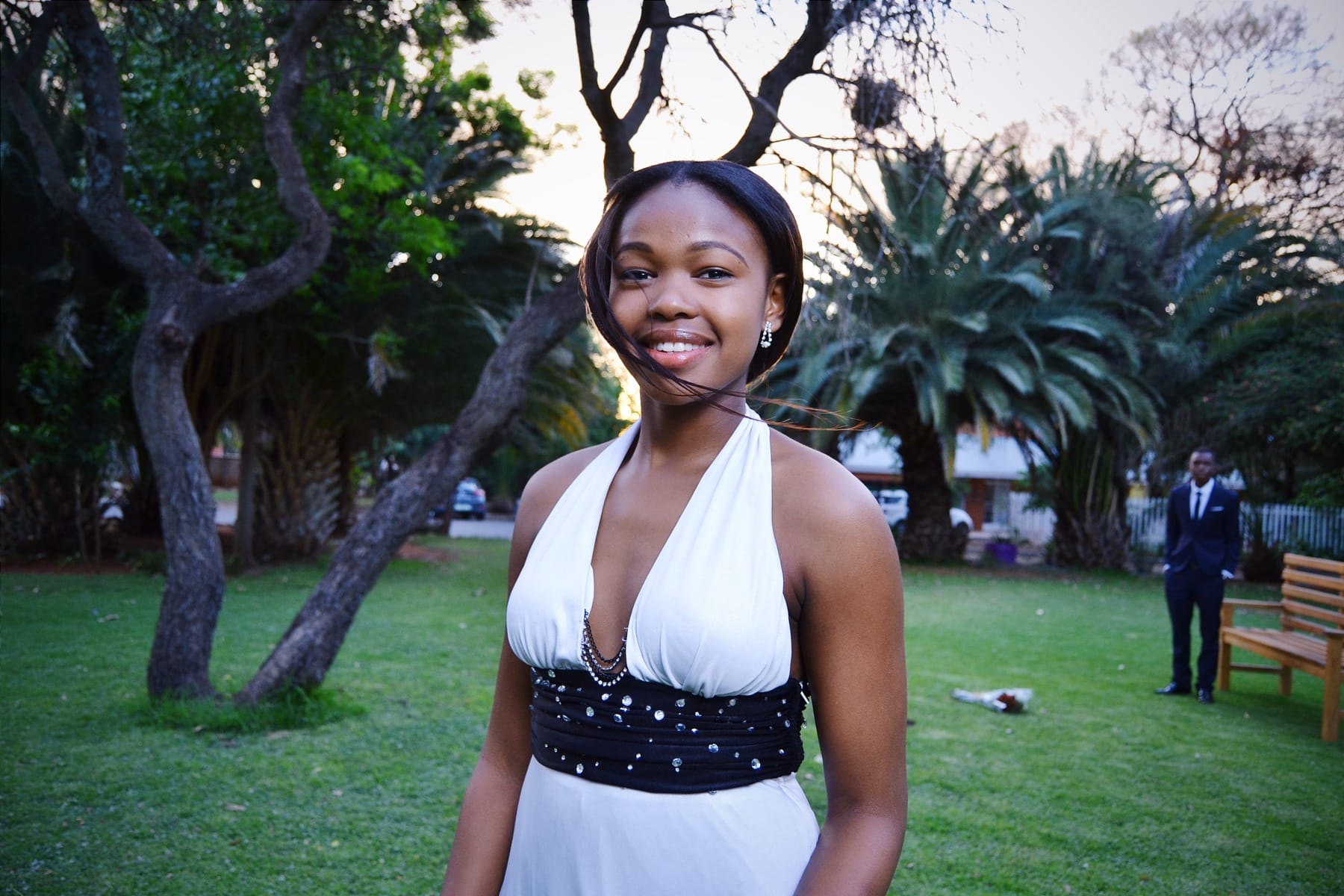 Matric dance, her smile in the garden, him by the bench