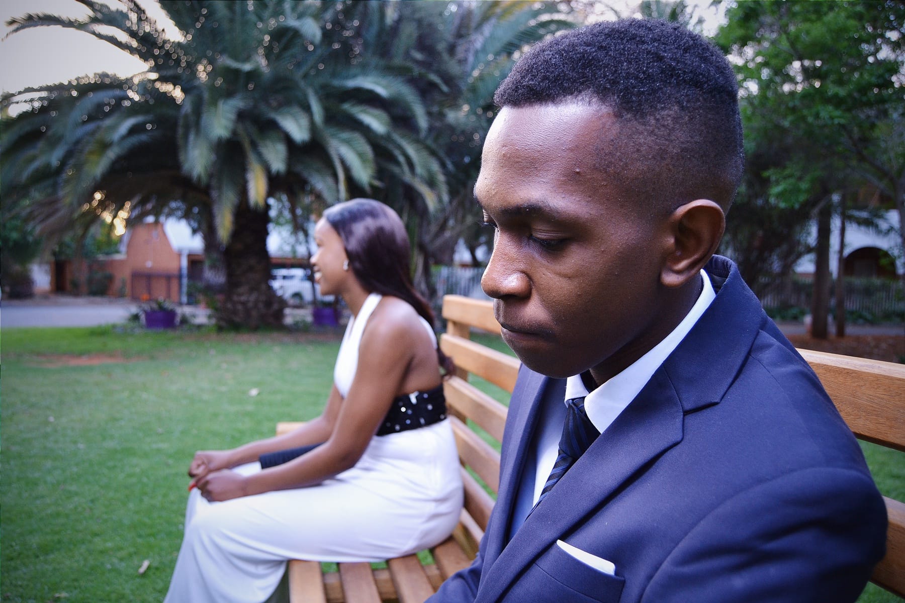 Matric dance, his profile with her smiling behind