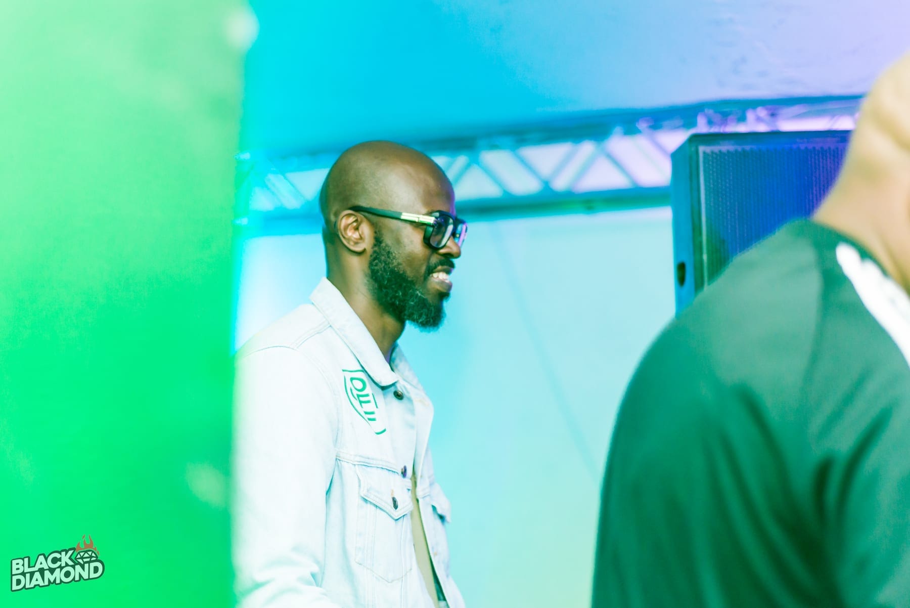 Black Coffee grinning at the decks