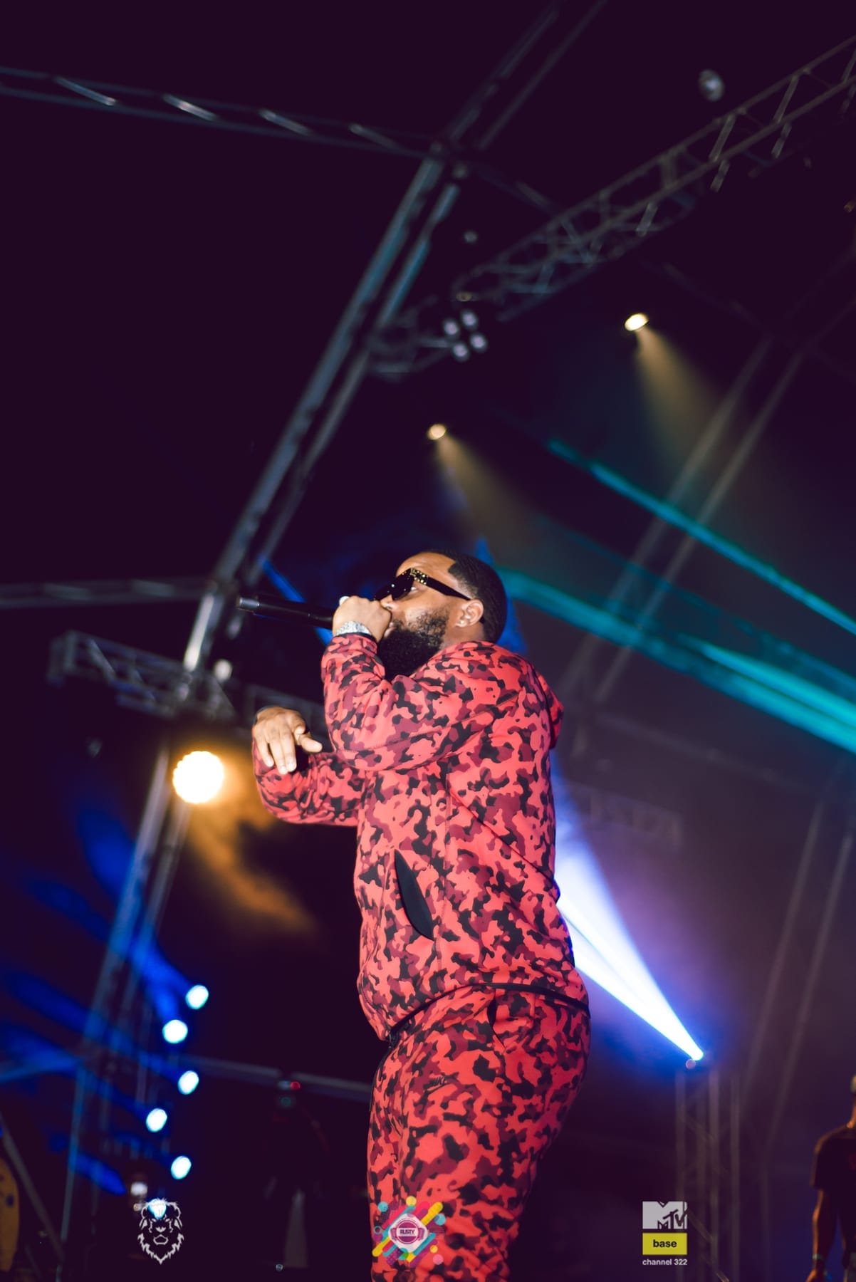 Rapper in a red camo suit on the mic