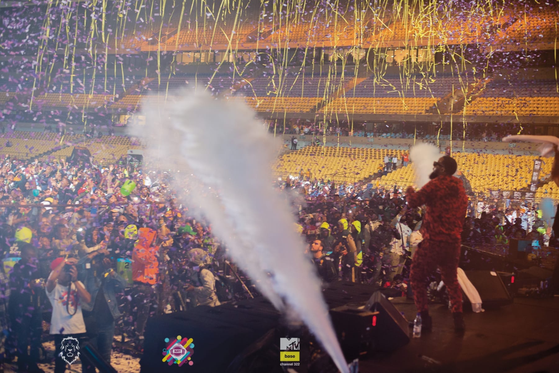 CO2 cannon firing over a stadium crowd as confetti falls